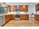Updated kitchen with stainless appliances, ample counter space, and hardwood floors at 32 Skyline Dr, Wheat Ridge, CO 80215