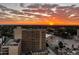 Breathtaking aerial view of a city skyline at sunset with beautiful orange and pink clouds at 100 Park W Ave # 1403, Denver, CO 80205
