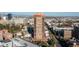 Scenic aerial view of the high-rise building, showcasing panoramic cityscape and mountain views in the distance at 100 Park W Ave # 1403, Denver, CO 80205