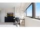 Bright bedroom featuring large windows with a work desk, allowing ample natural light at 100 Park W Ave # 1403, Denver, CO 80205