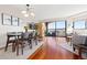 Open concept dining area with city views, access to balcony, and modern decor at 100 Park W Ave # 1403, Denver, CO 80205