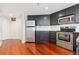 Well-equipped kitchen featuring stainless steel appliances and ample cabinet space at 100 Park W Ave # 1403, Denver, CO 80205