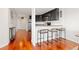 Open concept kitchen with breakfast bar, stainless steel appliances, and hardwood floors at 100 Park W Ave # 1403, Denver, CO 80205