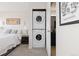 Convenient stacked washer and dryer in the unit, located near the bedroom at 100 Park W Ave # 1403, Denver, CO 80205