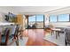 Stylish living area featuring a balcony with stunning city views, and modern furnishings at 100 Park W Ave # 1403, Denver, CO 80205