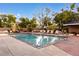Inviting outdoor pool area with comfortable lounge chairs, lush landscaping, and a serene atmosphere at 100 Park W Ave # 1403, Denver, CO 80205