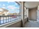 Private balcony with wrought iron railing offers a relaxing place to enjoy the community views at 10050 E Gunnison Pl # 805, Aurora, CO 80247