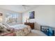 Serene bedroom featuring a large window, offering natural light and a peaceful ambiance at 10050 E Gunnison Pl # 805, Aurora, CO 80247