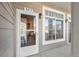 Welcoming front entrance with glass door and view of a bright interior. Natural light streams through a side window at 10050 E Gunnison Pl # 805, Aurora, CO 80247