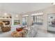 Cozy living room with fireplace, arched shelving, and sliding doors to balcony, creating a warm and inviting space at 10050 E Gunnison Pl # 805, Aurora, CO 80247