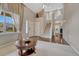 Grand foyer featuring high ceilings, a staircase, hardwood floors, and ample natural light at 5625 S Buchanan St, Aurora, CO 80016