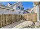 Private backyard featuring a stamped concrete patio and a wood fence at 8562 E 49Th Pl, Denver, CO 80238