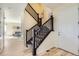 Home entryway and staircase with wood floors and neutral walls at 8562 E 49Th Pl, Denver, CO 80238