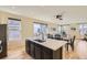 Modern kitchen island with sleek countertops, stainless steel appliances, and natural light at 8562 E 49Th Pl, Denver, CO 80238