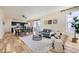 Bright living room showcasing open floor plan, hardwood floors, and stylish furniture at 8562 E 49Th Pl, Denver, CO 80238