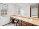 Bathroom featuring a vanity with a large mirror and a neutral countertop, offering functionality and style at 14333 E Warren Pl, Aurora, CO 80014