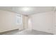 Neutral bedroom has carpet, a window, a door, and a radiator at 14333 E Warren Pl, Aurora, CO 80014