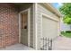 Exterior of the home with brick accents, a two car garage, and visible house numbers at 14333 E Warren Pl, Aurora, CO 80014