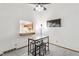 Bright living room with bar access to the kitchen featuring modern decor and a cohesive design at 14333 E Warren Pl, Aurora, CO 80014