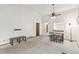 Bright living room boasts high ceilings and an open layout, with bar access to the kitchen at 14333 E Warren Pl, Aurora, CO 80014