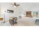 Bright living room with vaulted ceiling, cozy fireplace, and a sliding glass door at 14333 E Warren Pl, Aurora, CO 80014