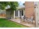 Outdoor patio with seating, seamlessly connecting the indoor and outdoor spaces of this charming home at 14333 E Warren Pl, Aurora, CO 80014