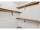 Spacious walk-in closet with multiple shelves and rods, providing ample storage and organization at 14333 E Warren Pl, Aurora, CO 80014