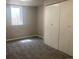 Finished basement bedroom with plush carpet, closet, and a bright, airy feel at 1326 S Canosa Ct, Denver, CO 80219