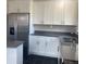 Modern kitchen features stainless steel appliances, sleek gray countertops, and ample cabinet space at 1326 S Canosa Ct, Denver, CO 80219