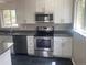 Well-appointed kitchen featuring stainless steel appliances and ample counter space at 1326 S Canosa Ct, Denver, CO 80219