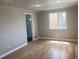 Inviting living room features hardwood floors, a large window, and a welcoming entrance at 1326 S Canosa Ct, Denver, CO 80219