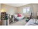 Bedroom with large window, beige carpet, and neutral walls at 1112 Elysian Field Dr # E, Lafayette, CO 80026