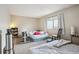Bedroom with large window, beige carpet, and neutral walls at 1112 Elysian Field Dr # E, Lafayette, CO 80026