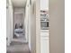 Hallway view showcasing easy access to all bedrooms and other living spaces at 1112 Elysian Field Dr # E, Lafayette, CO 80026
