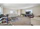Bright living room featuring neutral colors, plush carpet, and plenty of space at 1112 Elysian Field Dr # E, Lafayette, CO 80026
