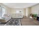 Spacious living room with neutral decor, large windows and carpeted floors at 1112 Elysian Field Dr # E, Lafayette, CO 80026