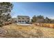 Backyard with a brown lawn and view of house at 3416 Hawthorne Dr, Highlands Ranch, CO 80126