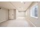 Finished basement with neutral carpet, recessed lighting, and a window providing natural light at 3416 Hawthorne Dr, Highlands Ranch, CO 80126
