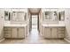 Dual sinks and vanity with modern tile in a naturally lit bathroom at 3416 Hawthorne Dr, Highlands Ranch, CO 80126