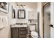 Charming bathroom with granite counters, modern lighting, and convenient built-in storage at 3416 Hawthorne Dr, Highlands Ranch, CO 80126