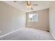 Bright bedroom featuring neutral walls, carpeted floors, and a window with natural light at 3416 Hawthorne Dr, Highlands Ranch, CO 80126
