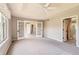 Spacious bedroom boasting natural light, a ceiling fan, and classic French doors at 3416 Hawthorne Dr, Highlands Ranch, CO 80126