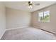 Neutral bedroom featuring natural light and carpeted floors at 3416 Hawthorne Dr, Highlands Ranch, CO 80126