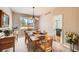 Inviting dining room with stylish chandelier, carpet, and abundant natural light at 3416 Hawthorne Dr, Highlands Ranch, CO 80126