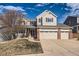 Charming two-story home featuring a three-car garage and well-maintained lawn at 3416 Hawthorne Dr, Highlands Ranch, CO 80126