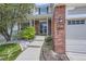 Inviting home entrance with stone landscaping, covered porch, and updated address numbers at 3416 Hawthorne Dr, Highlands Ranch, CO 80126
