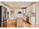 Bright kitchen with stainless steel appliances, granite countertops, and a center island at 3416 Hawthorne Dr, Highlands Ranch, CO 80126