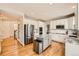 Bright kitchen featuring white cabinets, stainless steel appliances and granite countertops at 3416 Hawthorne Dr, Highlands Ranch, CO 80126