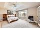 Spacious main bedroom featuring a tray ceiling, large windows and built-in bookshelves at 3416 Hawthorne Dr, Highlands Ranch, CO 80126