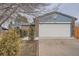 Cozy single-Gathering home with a white garage door and manicured front yard at 4234 S Bahama St, Aurora, CO 80013